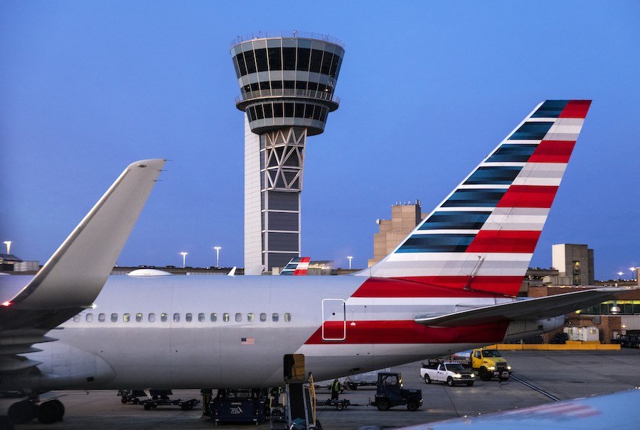 airplanes and the control tower at Philadelphia International Airport, where international flights have just resumed